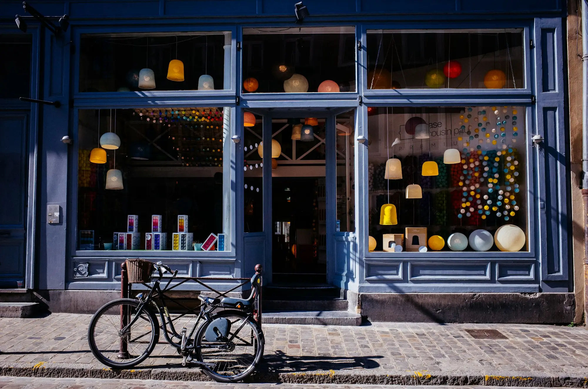 Independent retail shop owner arranging stock in a boutique on Ponsonby Road, Auckland